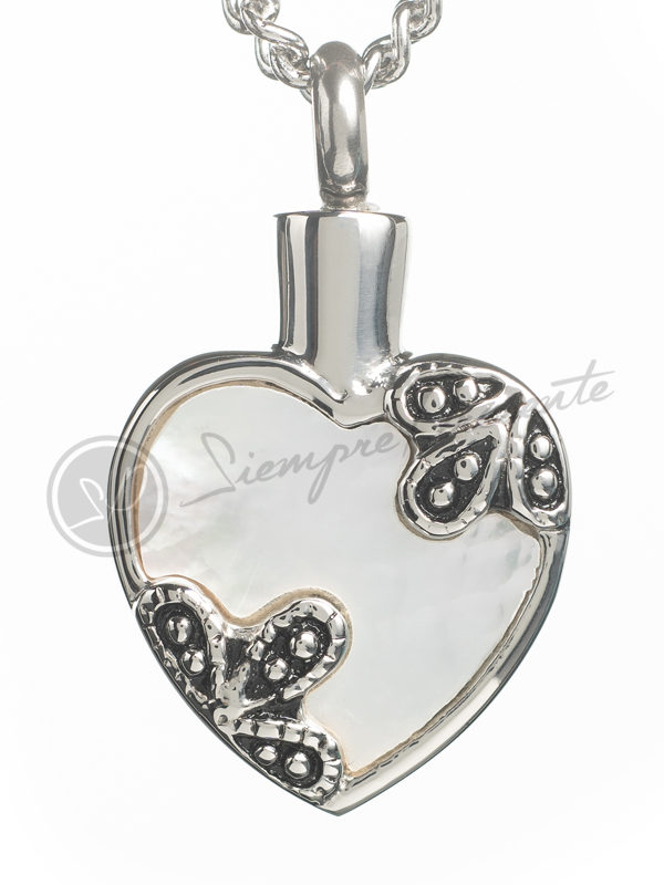 Colgante para cenizas con forma de corazon con una incrustacion de nacar